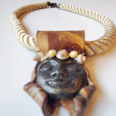 Wood and shell face pendant on rope necklace handmade, 1980's 