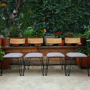 4 mid century modern style dining chairs with black metal legs