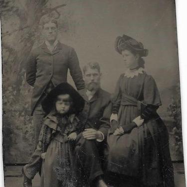 Tintype Photograph of Two Men, A Toung Woman, and a Child 