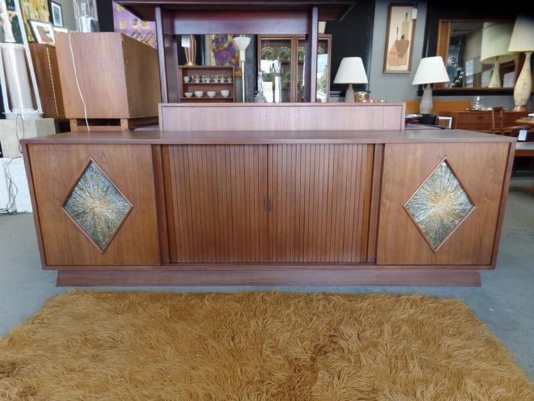 Mid-Century Modern walnut credenza with center tamboor doors and sliding outer doors with acrylic diamond inserts