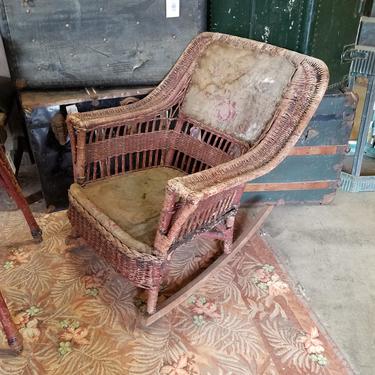 Antique wicker rocking chair as is