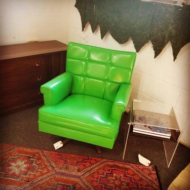 MCM green swivel chair. $375
