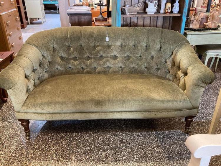 Tufted olive green love seat.  62” x 34” x 33” seat height 17”