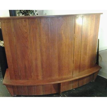 Gorgeous solid teak rounnded bar from 50s/60s was made in Denmark.  Four wide and deep open shelves for spirits and barware on reverse side, plus a deep drawer and