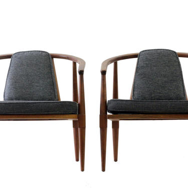 Pair of upholstered barrel back mid-century modern chairs 