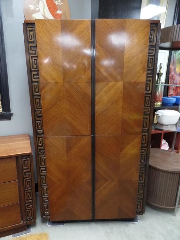 Walnut armoire with carved wood details