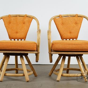 Pair of bamboo chairs with orange upholstery