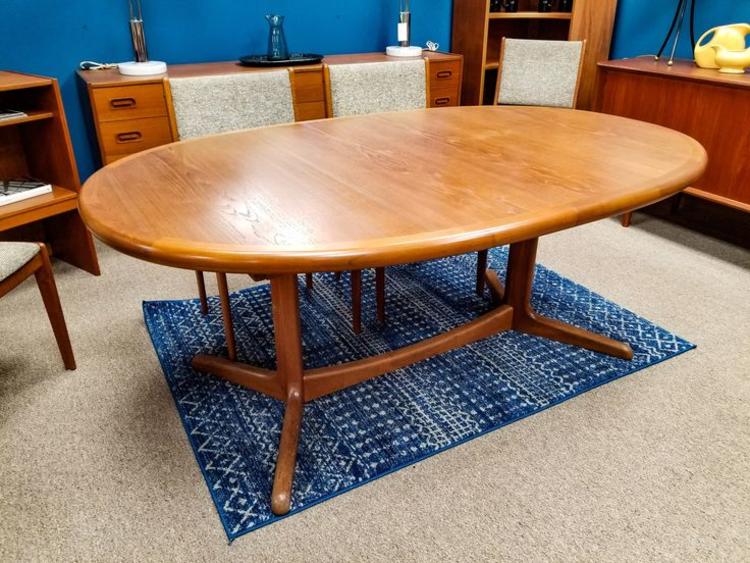 Danish Modern oval teak dining table with one extension