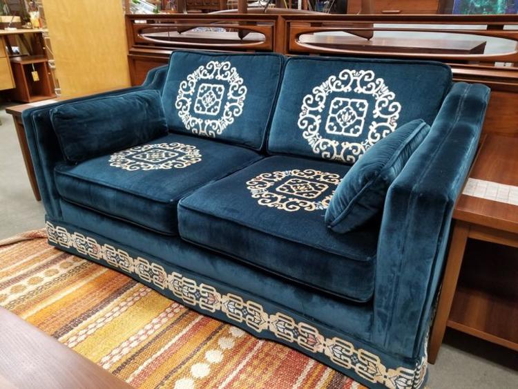                   Vintage teal velvet love seat with reversible cushions