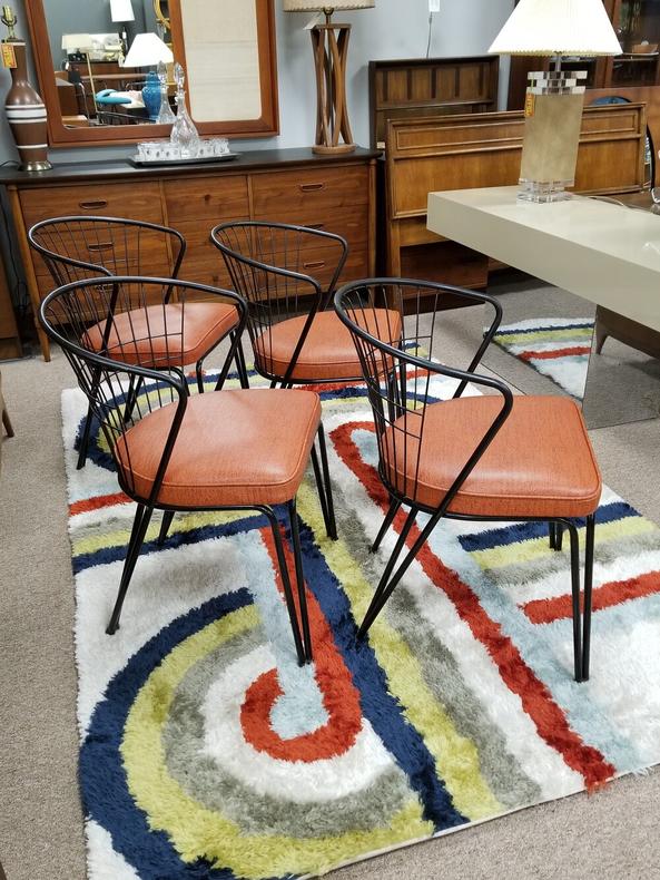 Set of four Mid-Century Modern metal frame dining chairs with curved backs