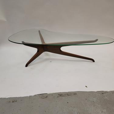 Kagan style trisymetric glass top coffee table