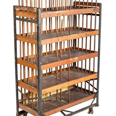 all original and completely intact early 20th century mobile "neverax" angled steel and wood compartmentalized carrying rack 