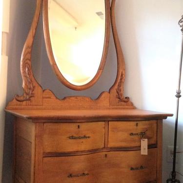 Oak dresser with tall oval mirror - $165