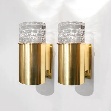 Scandinavian brass sconces with solid crystal shades