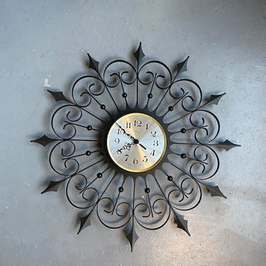 Mid century cast iron black atomic Welby starburst clock 