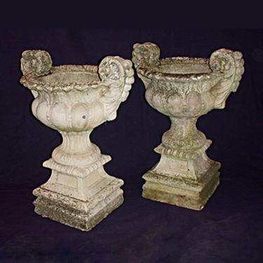 Pair of weathered cast concrete garden urns