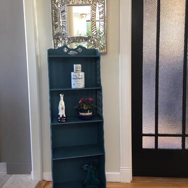 Tall blue vintage bookcase