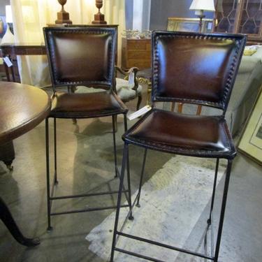 PAIR OF LEATHER AND WROUGHT IRON COUNTER STOOLS