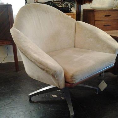 Velvet - upholstered swivel  and tilting lounge chair with walnut accents .  More Danish Modern at Hunted House.