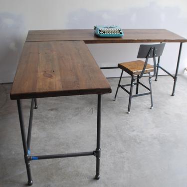 Standing L shape desk made of reclaimed wood. Choose desk height, base style, wood thickness and finish. 