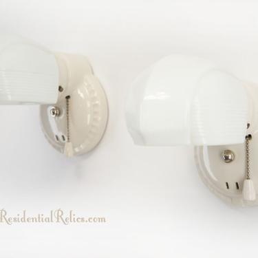 PAIR Porcelier bath sconces with hooded glass shades, circa 1930s