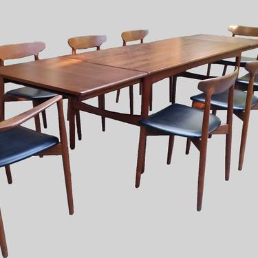 Danish teak dining table with leaves by Knud Anderson for Jensen 