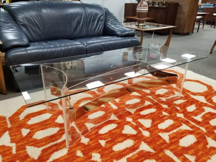                   Mid-Century Modern lucite and brass coffee table