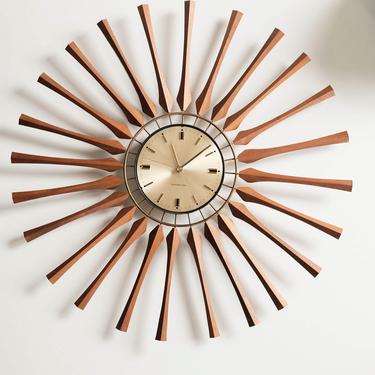 Mid Century Starburst Clock by General Electric, Brass clock face and Wood Starbursts with brass accents. 