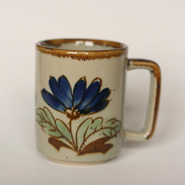 vintage speckled stoneware coffee mug with blue flowers made in japan 