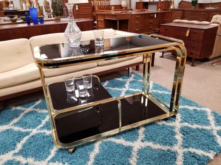                   Mid-Century Modern brass and black glass swing out barcart