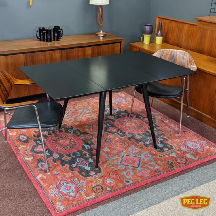 Mid-Century Modern ebonized drop-leaf dining table from the 'Planner' group by Paul McCobb