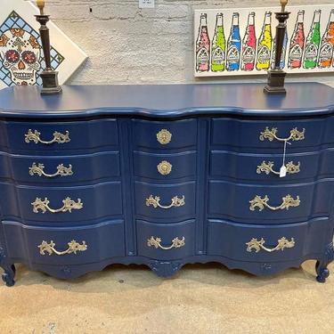 12 drawer ripple front French provincial dresser.  61” x 21” x 33”