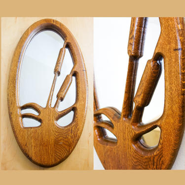 Large oval walnut wood framed mirror with cut out cattail reed motif 1980s floral home decor, perfect for entryway or hallway accent 