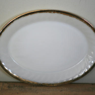 vintage fire king oval glass swirl platter with gold edge 