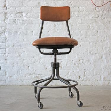 reupholstered vintage industrial adjustable rolling stool by the Fritz-Cross Company of St. Paul 1, MN 