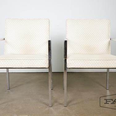 Pair of chrome framed arm chairs