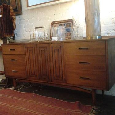Broyhill "Sculptra" long dresser-credenza is 66 inches long with 9 drawers 3 of which are hidden and pull out. Newly arrived at Hunted House.