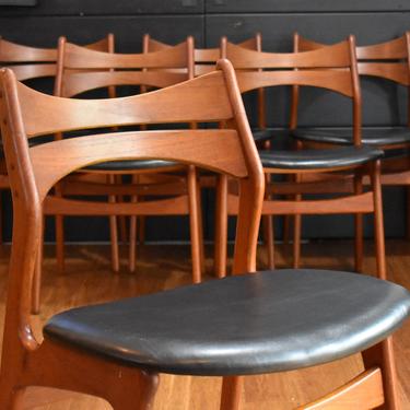 Eight Danish teak Erik Buch model 310 dining chairs w/black faux leather seats (two captains, six armless) 