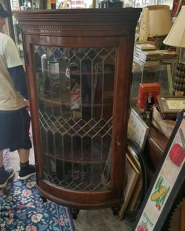 SOLD.                   Leaded Glass Door Corner Cabinet, $647.