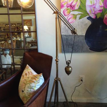 Brass tripod weighted floor lamp