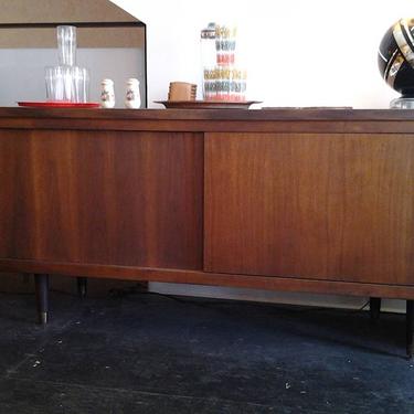 Danish Modern walnut sliding door credenza with tons of interior storage is 40% off at Hunted House.