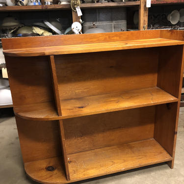 Wood bookcase with curved left edge 46” X 42.5” X 12”