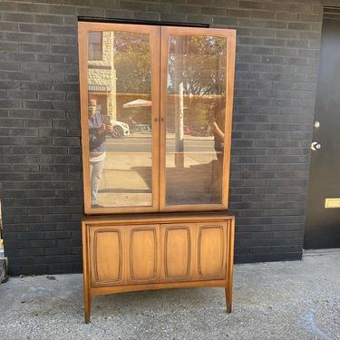 Mid Century two-piece glass front hutch. 38” W x 72” H x 17” D 