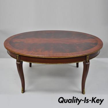 French Louis XV Style Flame Mahogany Oval Coffee Table with Brass Ormolu