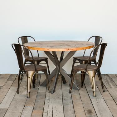 Modern Farmhouse Pedestal table made with reclaimed wood and steel intersections legs in your choice of color, size and finish 