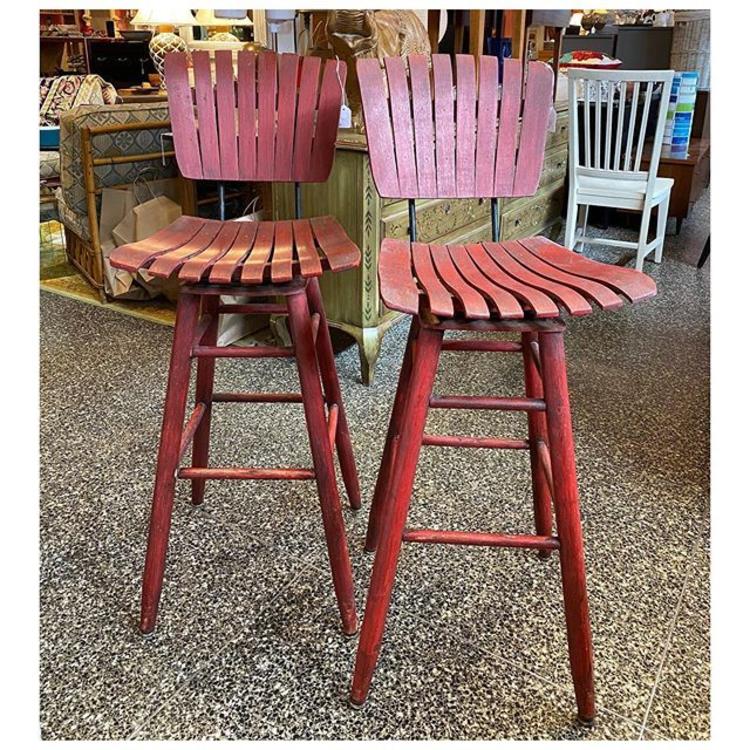 Pair of red painted swivel stools 43” height 