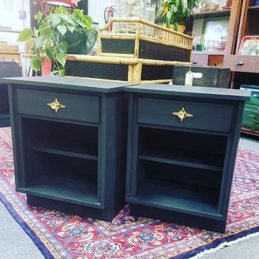                   Pair of grey refurbished side tables with original atomic hardware.