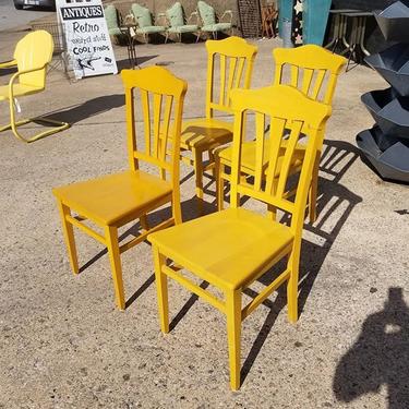 Set of 4 yellow dining chairs. $89