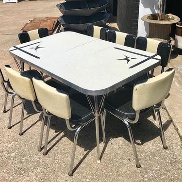                   retro Formica and chrome expandable diner table, together with 8 glittering black