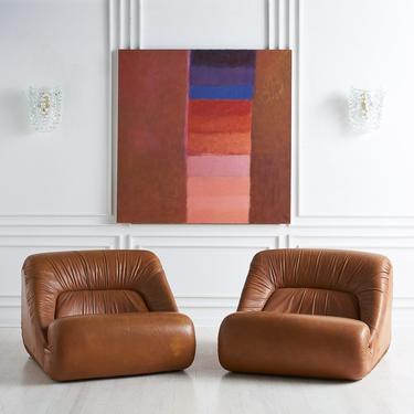 Pair of Leather Lounge Chairs by Jean Prevost
